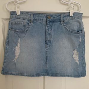 Distressed denim skirt.